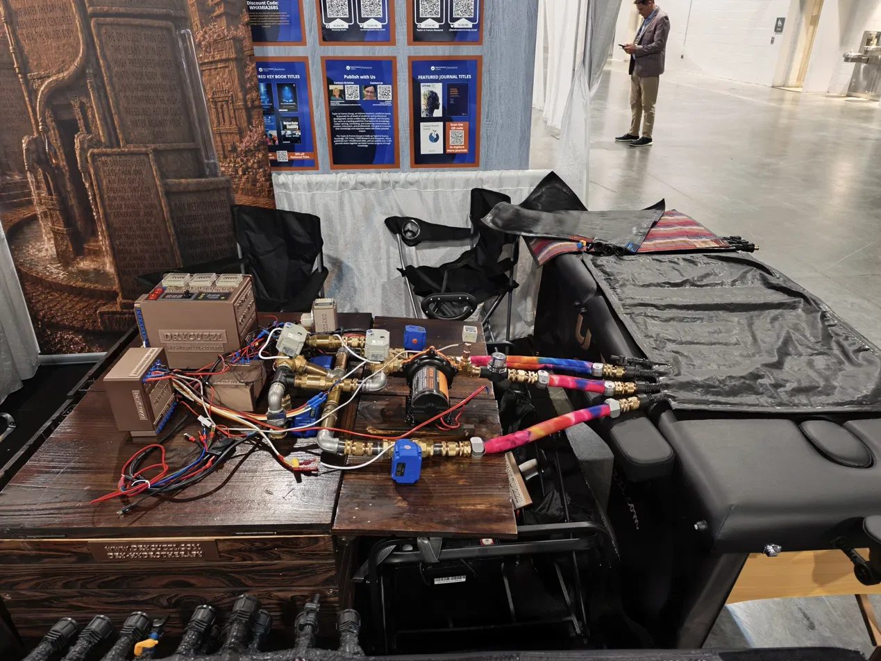 Side view of the Coma Bed wiring, pump and valve console at the booth